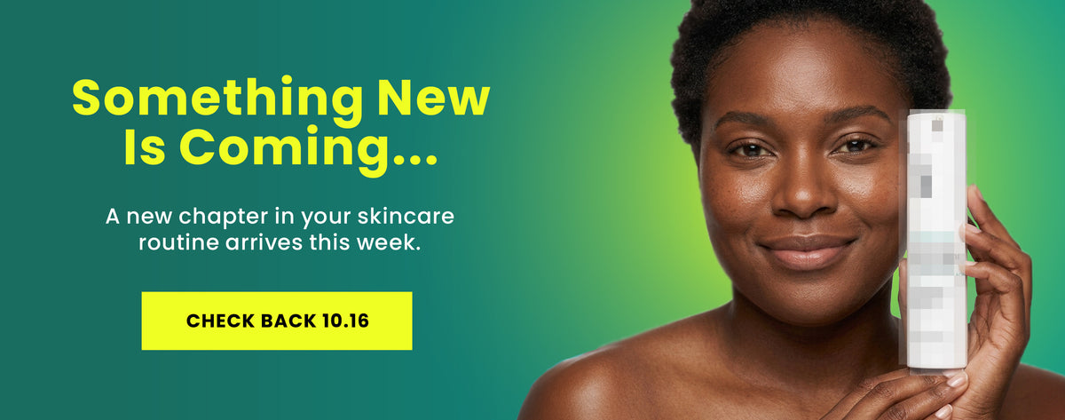 Woman holding a blurred out bottle of USRx skincare with promotional text 'Something new is coming'