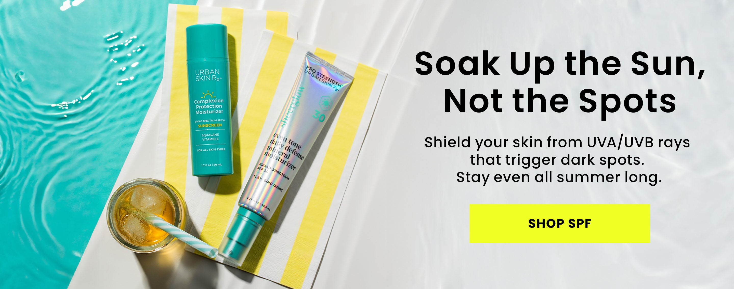 Bottles of Urban Skin RX Complexion Protection Moisturizer and Even Tone Daily Defense Mineral Moisturizer set against a pool setting