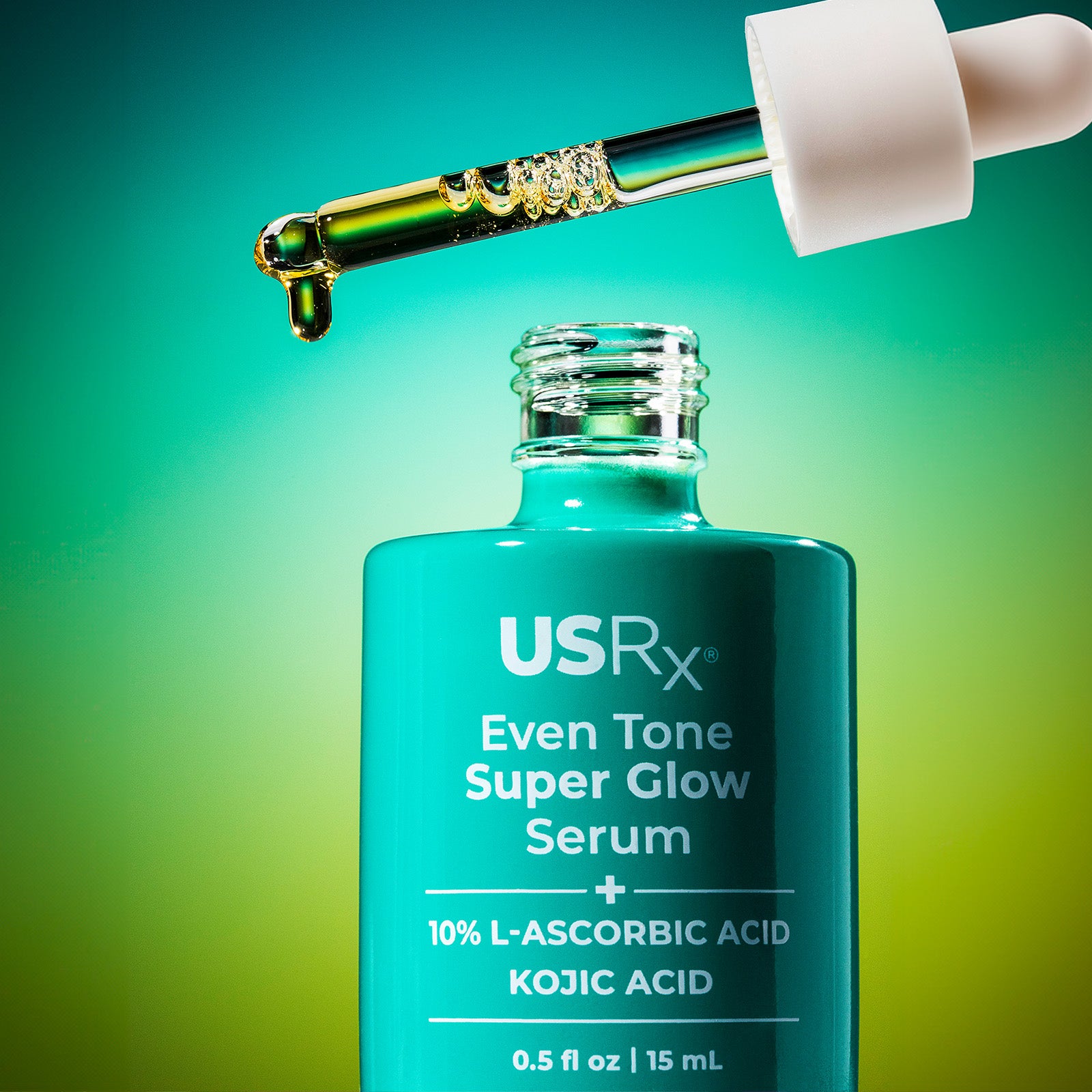 Open bottle of USRx Even Tone Super Glow Serum with product dispensing from dropper