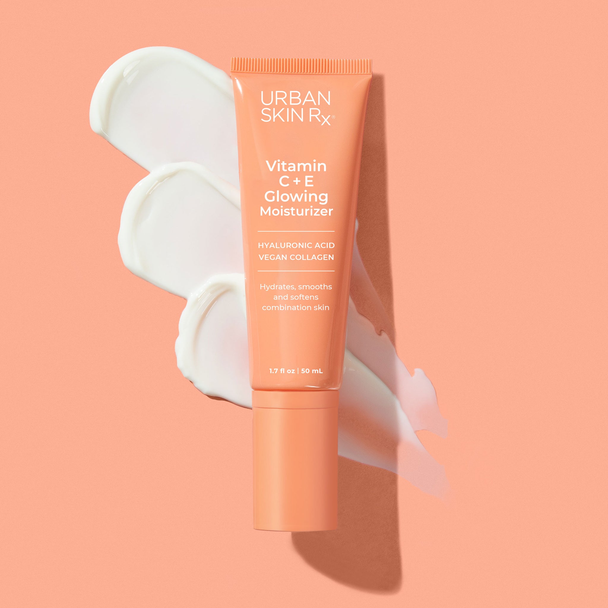 Bottle of Urban Skin RX Vitamin C + E Bright Glowing Moisturizer with a swatch of product on a pale pink background 