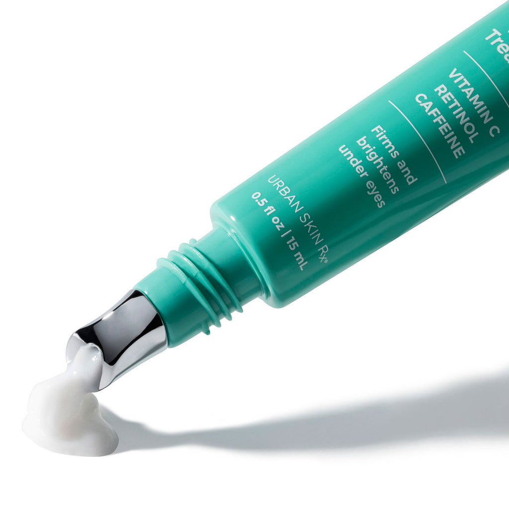 Product squeezing out of applicator tip of Tube of USRX Dark Circle Vitaleyez Treatment