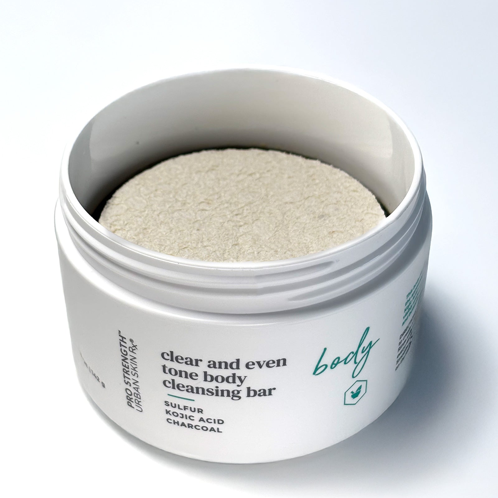 Open jar of Urban Skin RX Clear and Even Tone Body Cleansing Bar with round sponge applicator