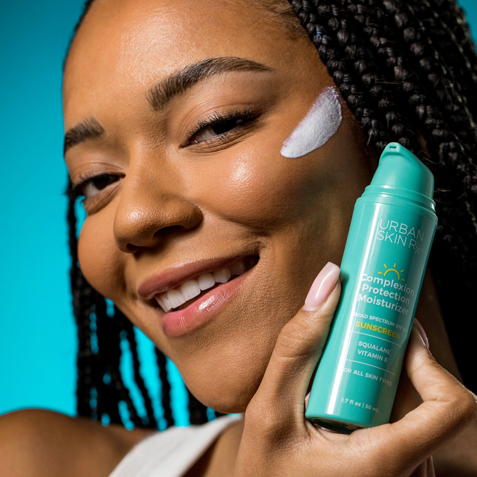 Woman applying Urban Skin RX Complexion Protection Moisturizer Sunscreen to her face