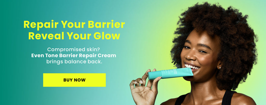 Smiling woman holding a tube of Urban Skin Rx Even Tone Barrier Repair Cream