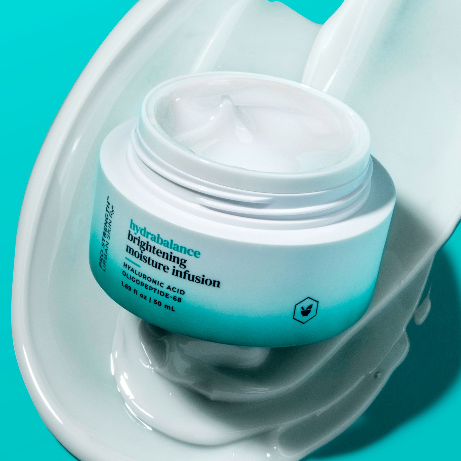 Open jar of USRx HydraBalance Brightening Moisture Infusion with a swatch of creamy white product shown beside jar