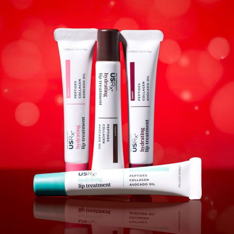 Assortment of USRx Tinted Hydrating Lip Treatments in 4 shades on a red background