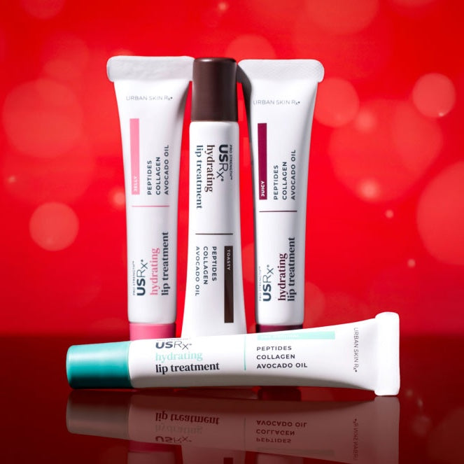 Assortment of USRx Tinted Hydrating Lip Treatments in 4 shades on a red background