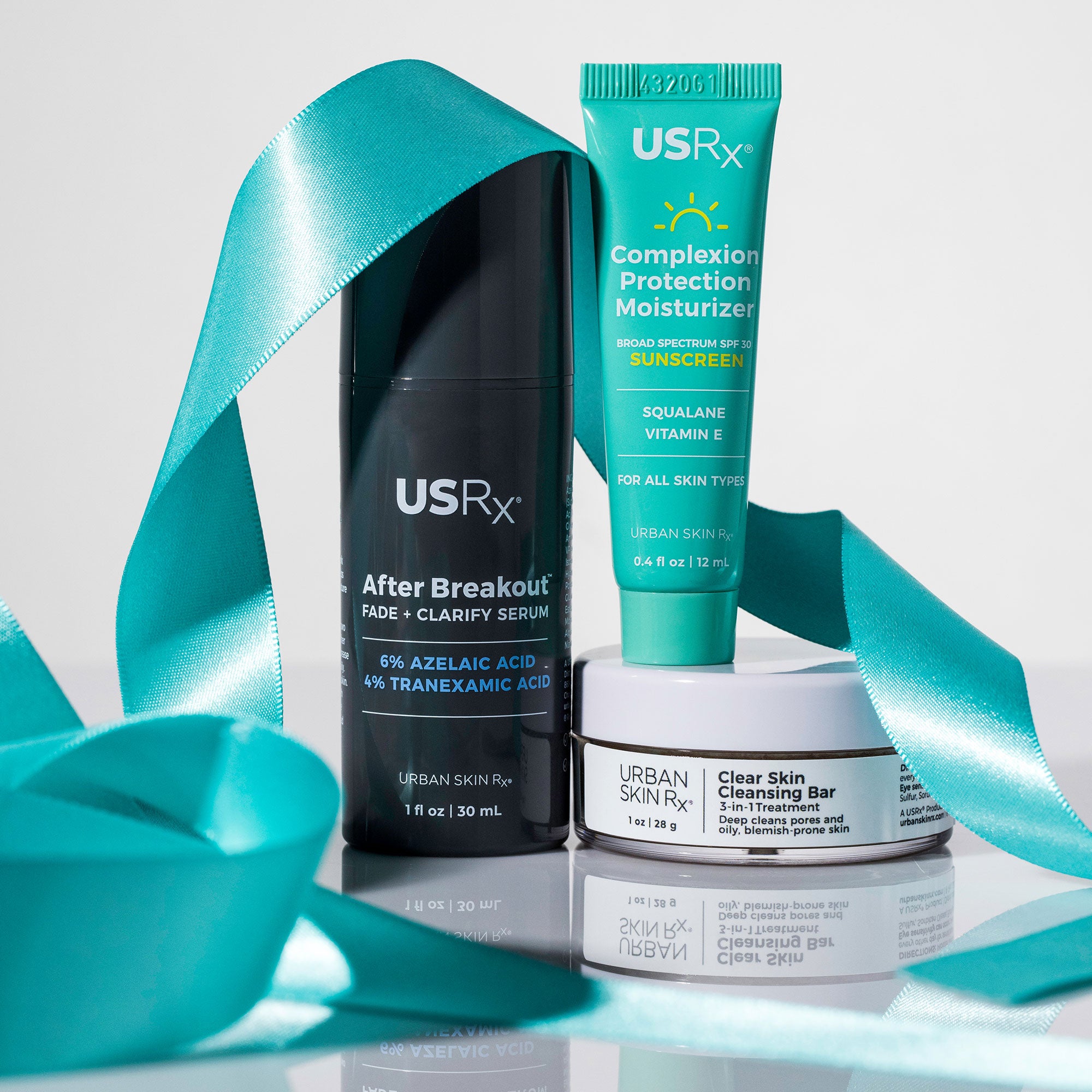 USRx Clear and Even Holiday Trio including various USRx clear skin products