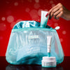 USRx Pro Strength Holiday Kit including USRx Lacticglow Cleanser, Hydrabalance Brightening Moisture Infusion, and Hydrating Lip Treatment with a Satin bonnet and branded travel bag on a red background