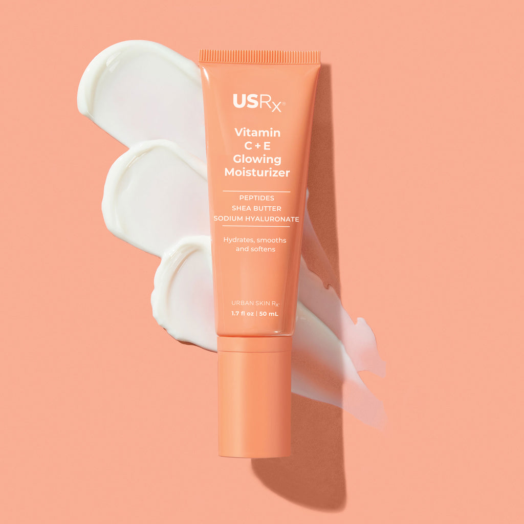 Tube of USRx Vitamin C + E Glowing Moisturizer on a pink background