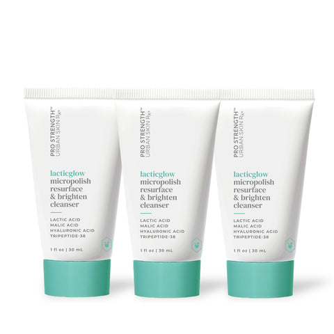 Three bottles of USRx Mini LacticGlow Cleanser on a white background
