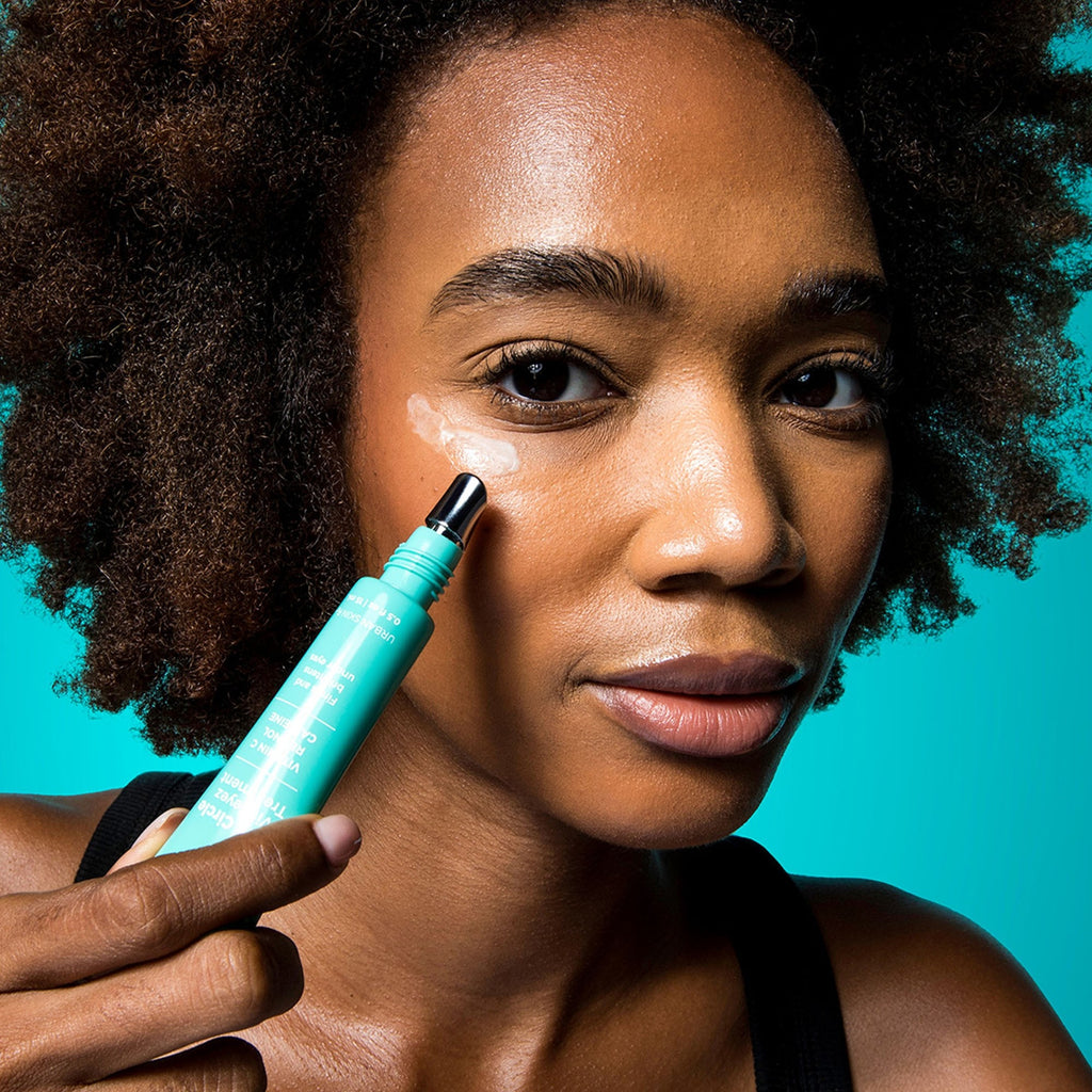 Woman applying USRx VitalEyez Treatment