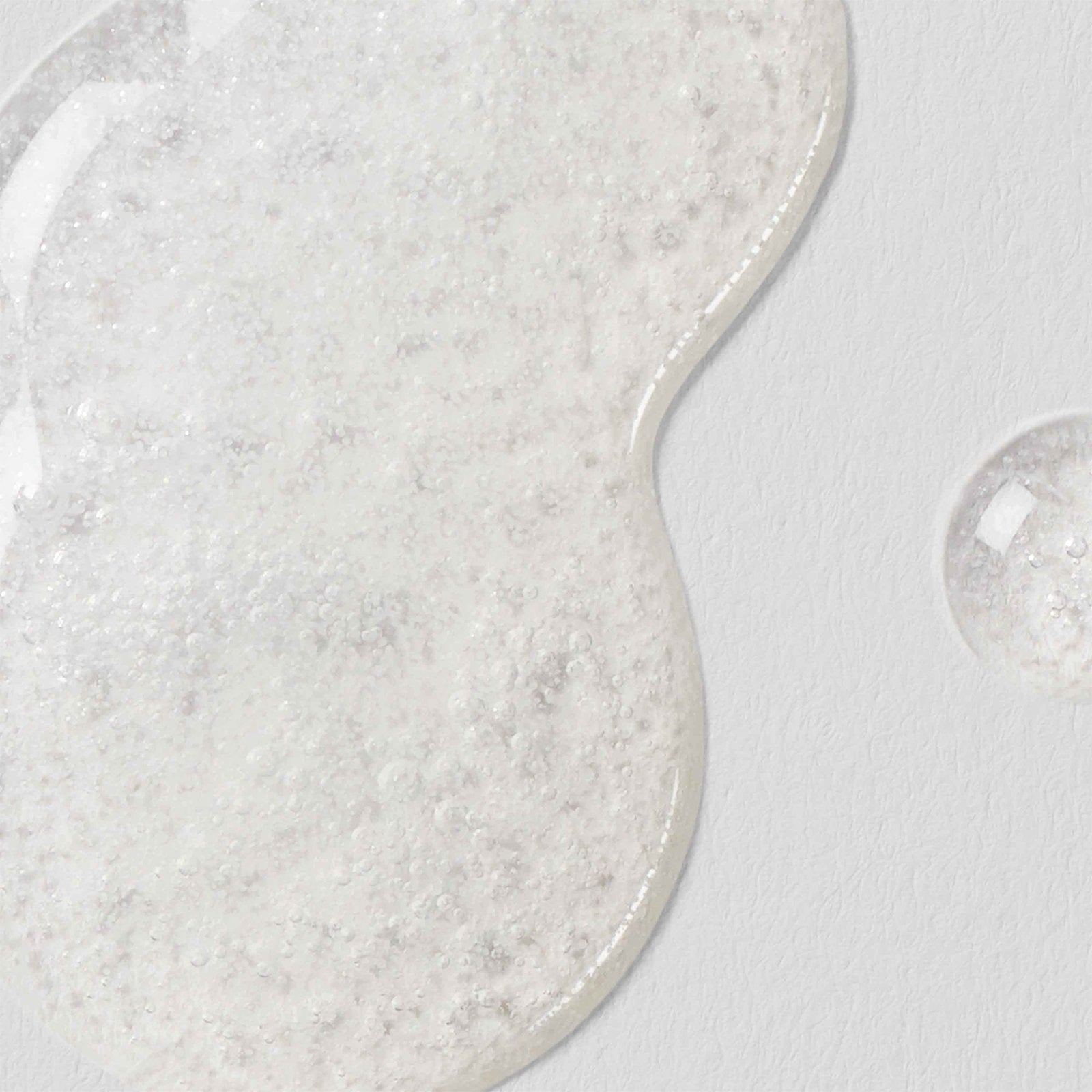 Clear sample of Lacticglow Micropolish Gentle Cleansing Gel with microbeads that gently exfoliate